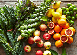 a group of fruits and vegetables on a wood surface Healthy Weight Loss Diets Liverpool